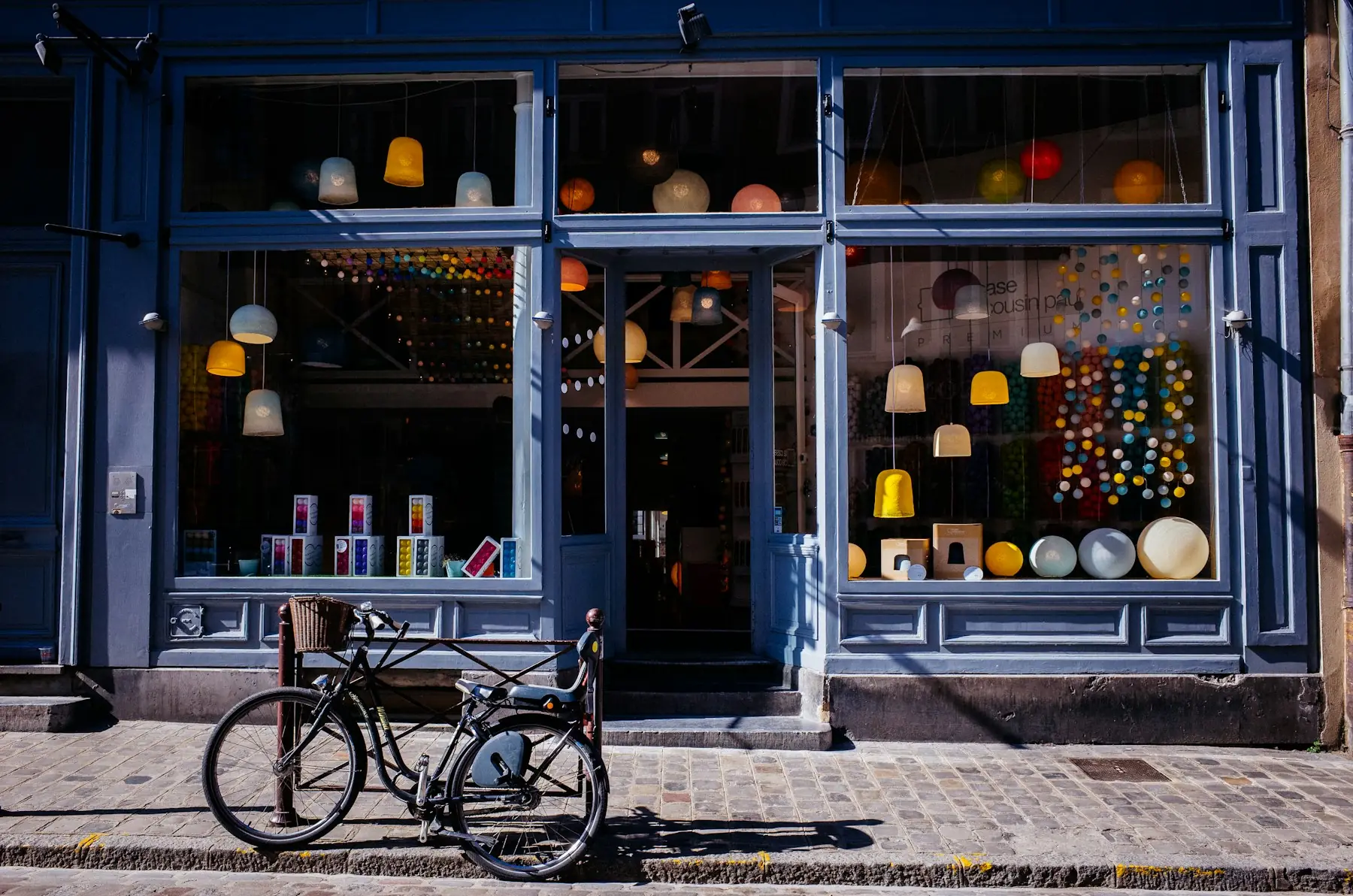 A shop storefront with bright display windows