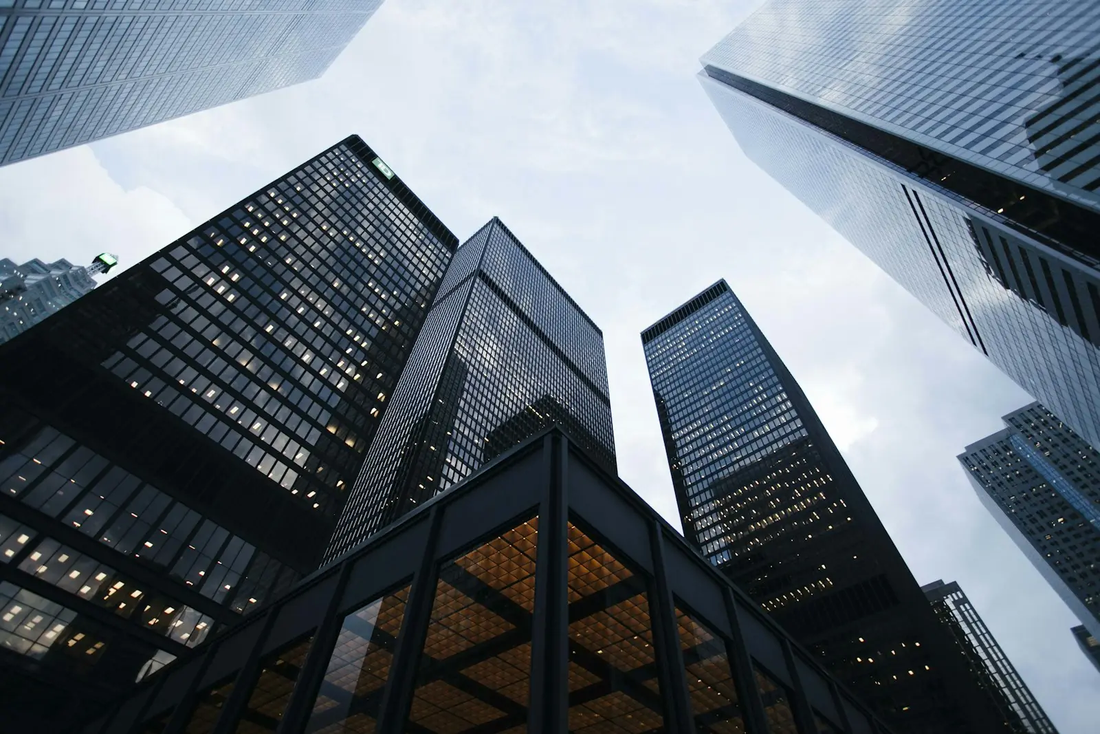 Looking up at tall glass office towers